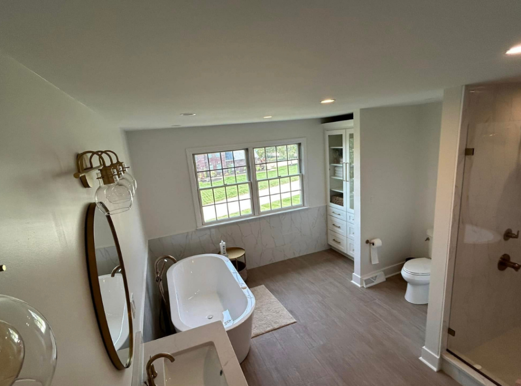 A newly renovated bathroom with free standing tub, cabinet, vanity and shower in the South Hills of Pitttsburgh
