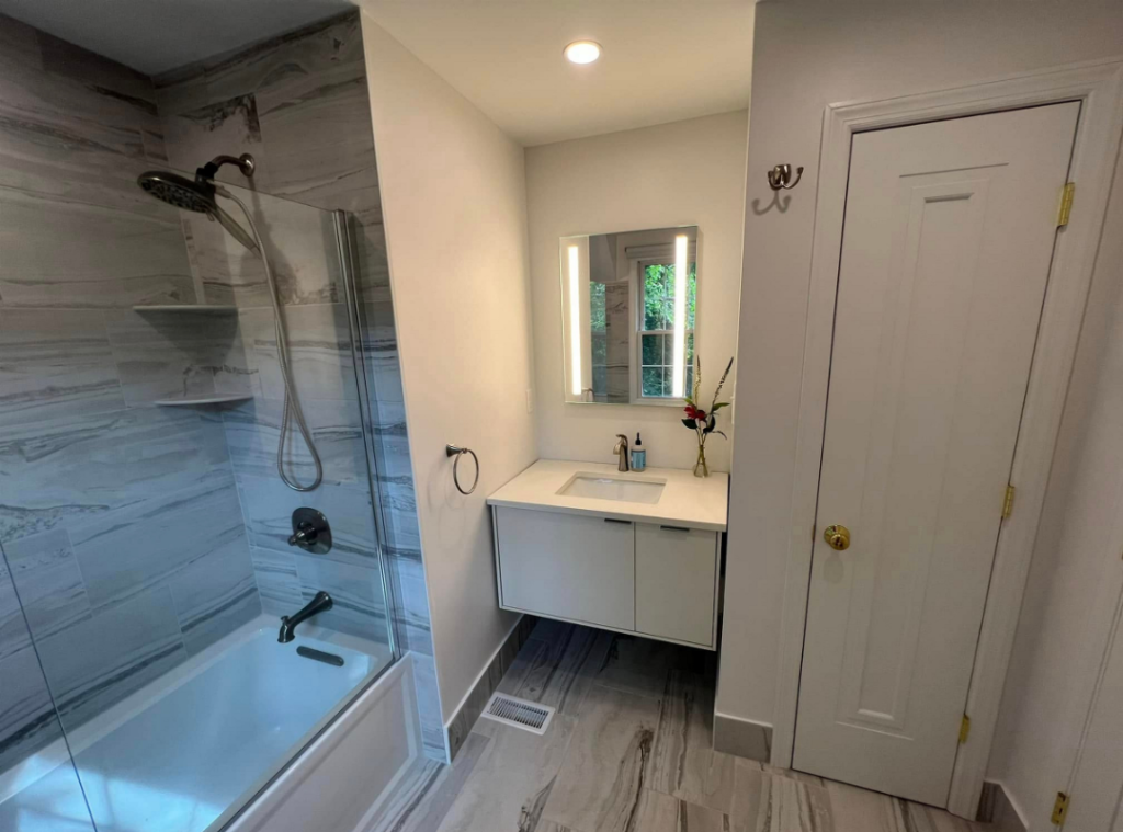 Bathroom remodel Pittsburgh PA vanity closet, bathtub, tile, and fixtures