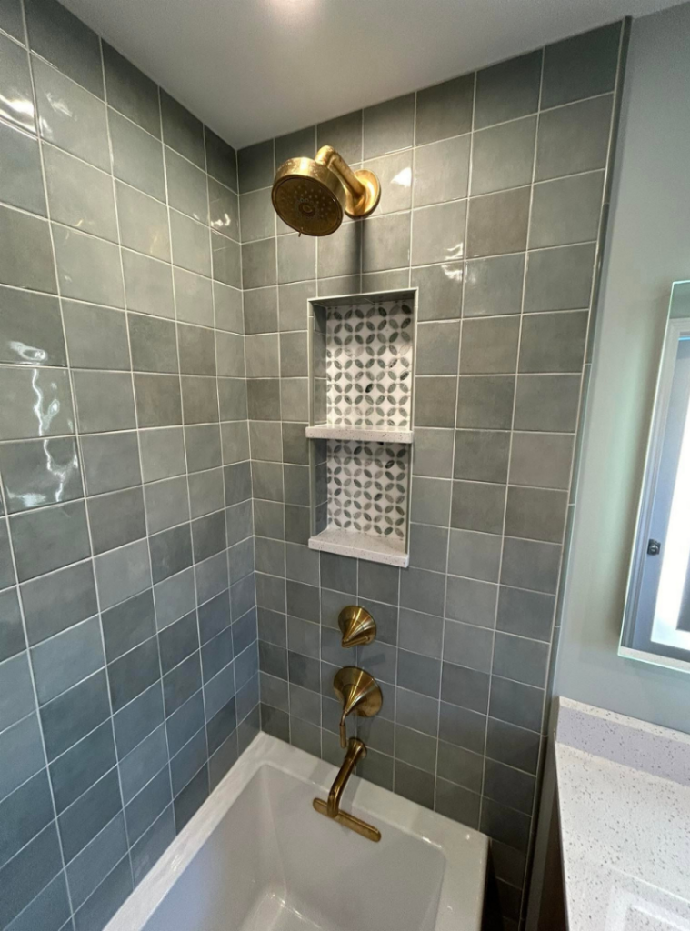 Bathroom remodel with new tub, tile, and faucets in Pittsburgh.
